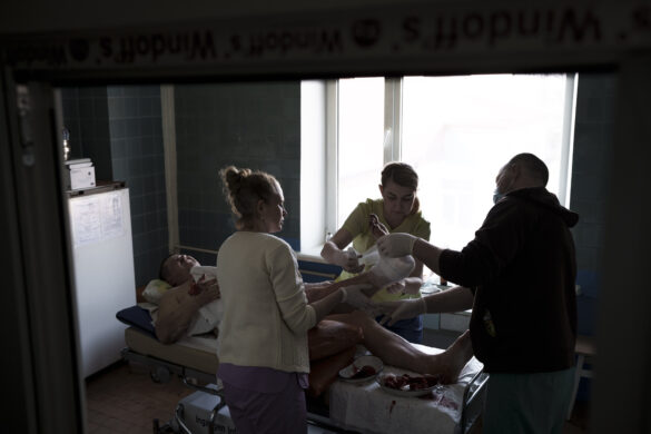 A man who was injured by shelling near his home is treated at a hospital in Brovary, north of Kyiv, Ukraine, Thursday, March 10, 2022. (AP Photo/Felipe Dana)
